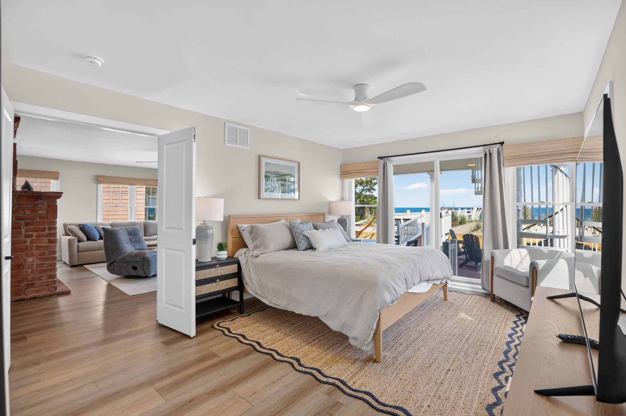 Master bedroom with ocean view and deck access
