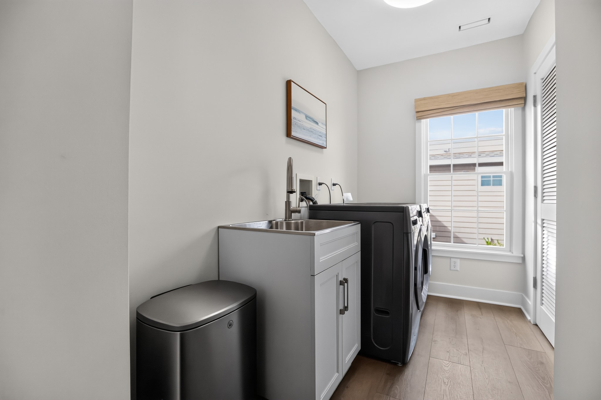 Spacious laundry room with full-size washer and dryer